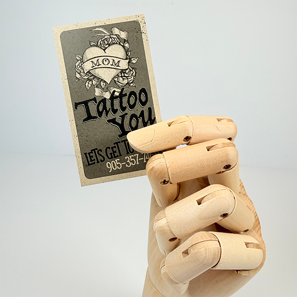 business card on kraft paper