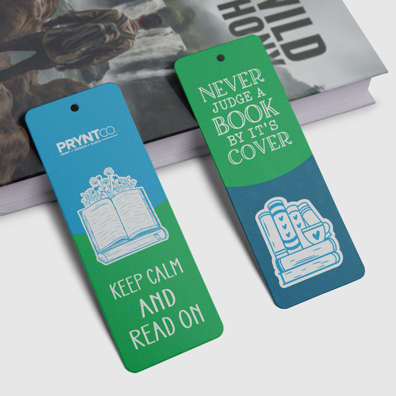 Bookmarks Blue and green custom bookmarks displayed on a desk