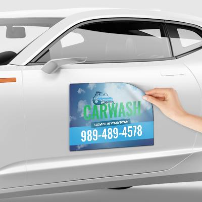Custom vehicle magnet displayed on the side of a car