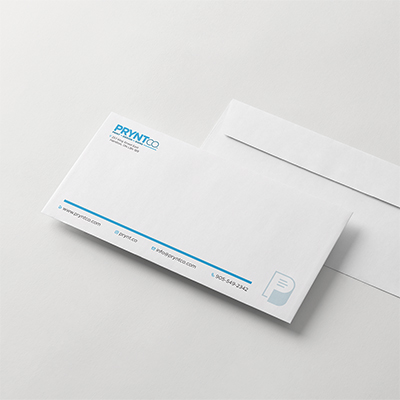 Custom printed envelopes arranged with matching business stationery