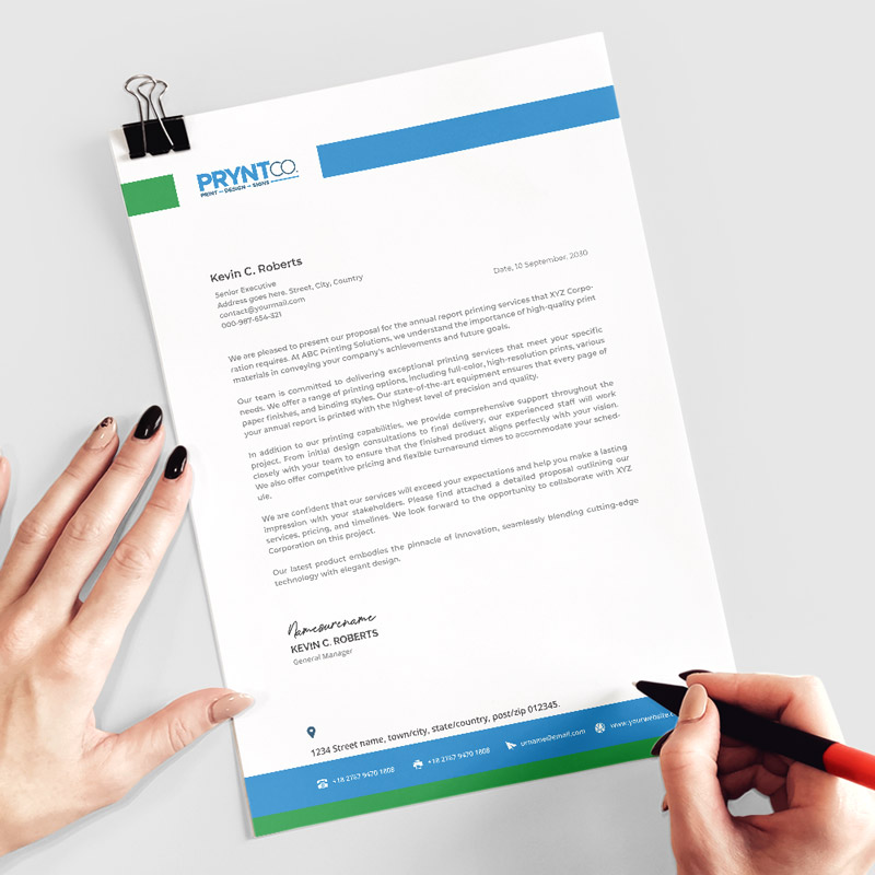 Custom letterhead sheets displayed with matching branded stationery