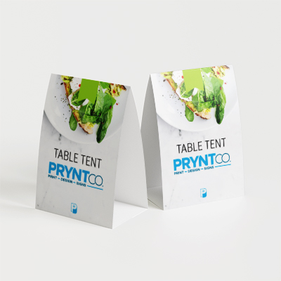 Folded custom tent cards standing on a tabletop