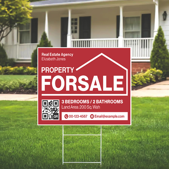 Real estate agency Property For Sale yard sign on a lawn
